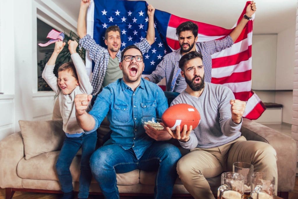 group of guys making a mess watching sports